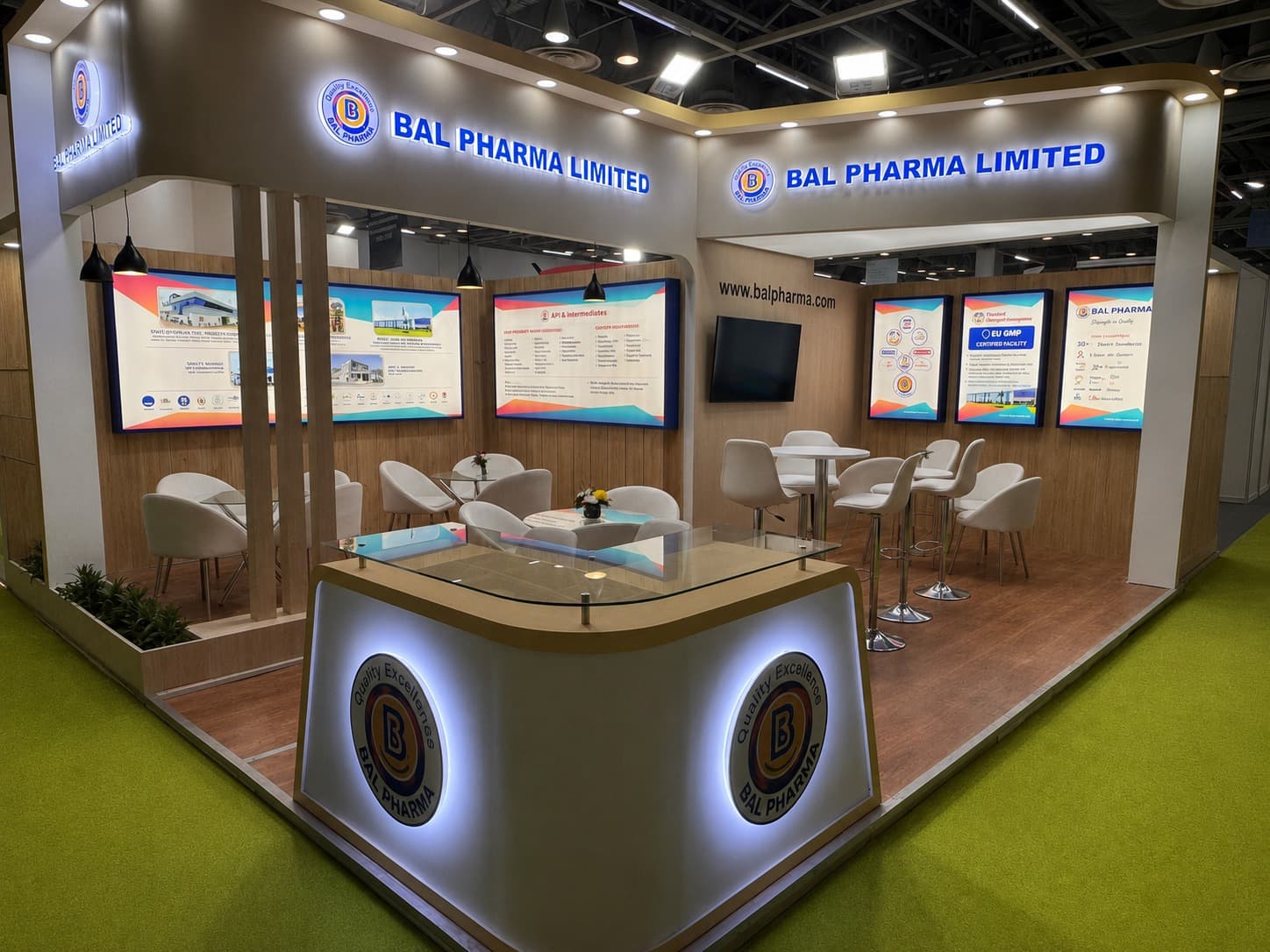 Bal Pharma exhibition stand — wood-toned hospitality and meeting area